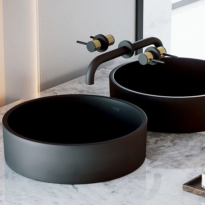 Beautiful round black bathroom washbasin with faucet