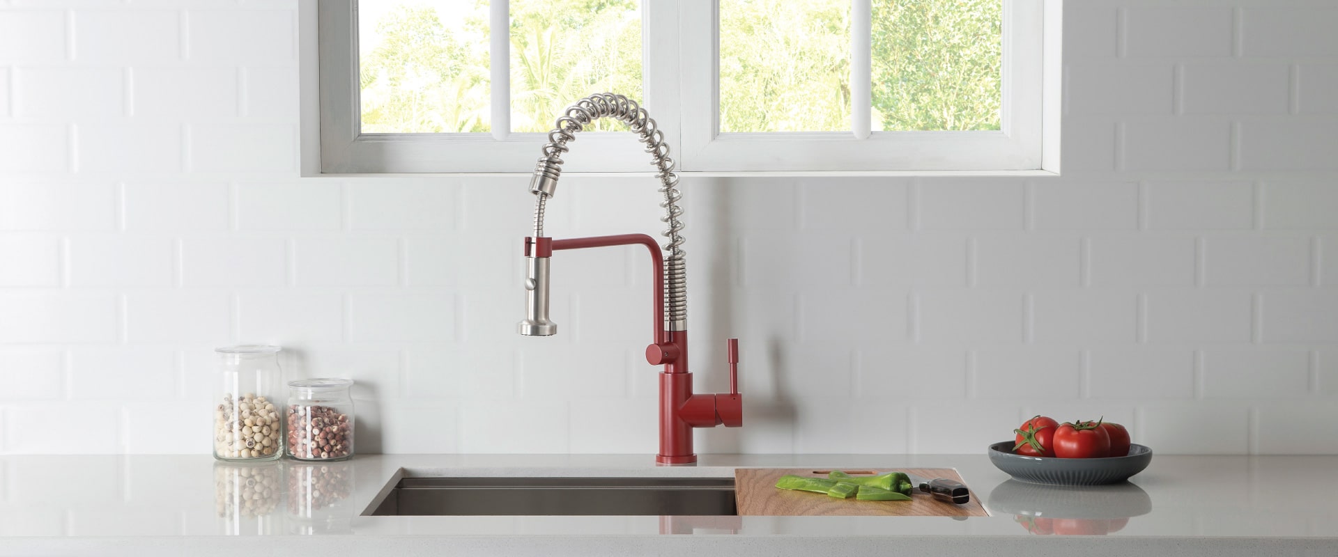 A hand basin with some tomatoes in plate