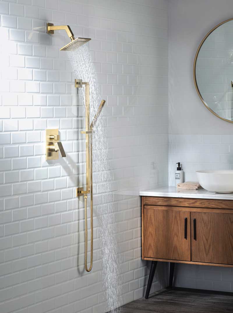 A premium bathroom with white tiles and mirrors