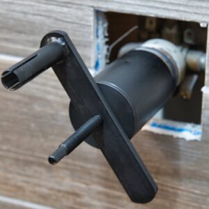 Exposed faucet valve and handle in wall